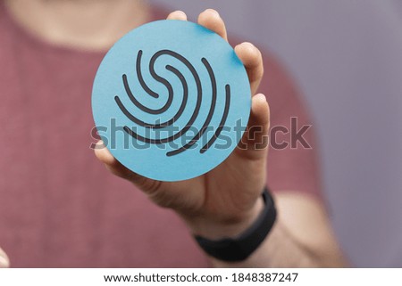 A hand holding a shield privacy security sign - protection concept