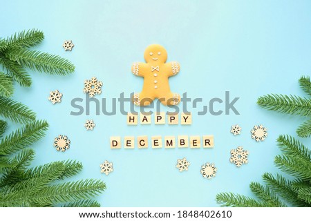 Happy December. gingerbread man, snowflakes, letters and fir tree. winter festive season. Christmas and New Year holiday background. flat lay