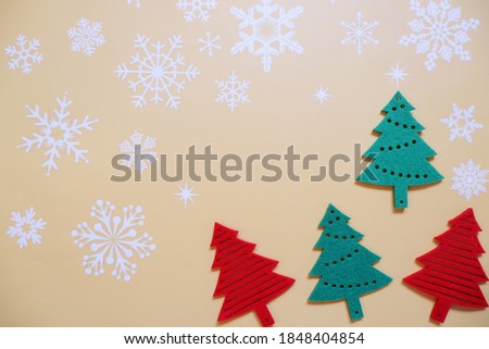 Christmas trees backgrounded snowflake. white Christmas flat layout.