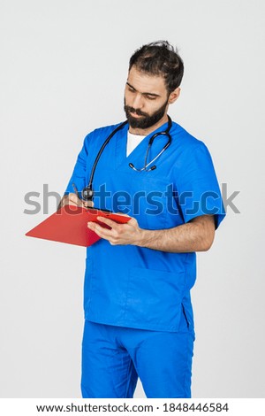 Middle-aged male doctor in blue uniform on white background showing different emotions.