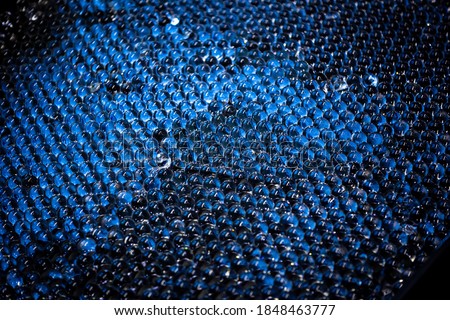 transparent hydrogel is highlighted in blue. on a dark background. texture