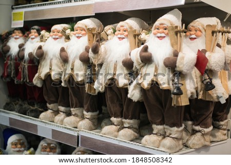the store shelves are lot of santaclause, shelf Christmas and new year goods, shop, fair, discounts, new year gifts, Santa shop, discount Christmas