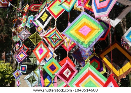 The image of the festival decoration with a beautiful colored square thread sheet.