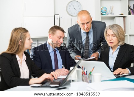 Business people developing strategy for teamwork in modern office. High quality photo