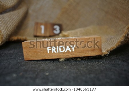 Friday 13th on wooden calendar. bad luck, Misfortune Day, Halloween Concept.  