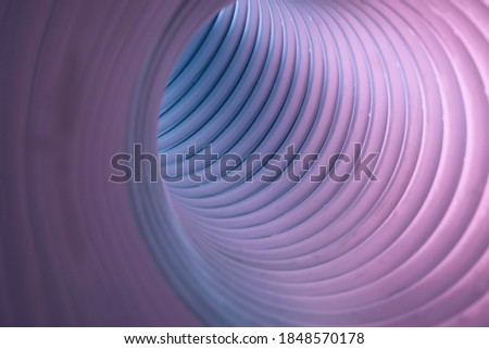 Beautiful round abstract gray tunnel with color light on a background pattern textured ford design.