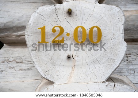 sign with a clock on a tree