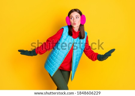 Photo of curious surprised funny cute girl teen go walk look copyspace want prepare secret christmas gift wear sweater pants isolated over bright color background