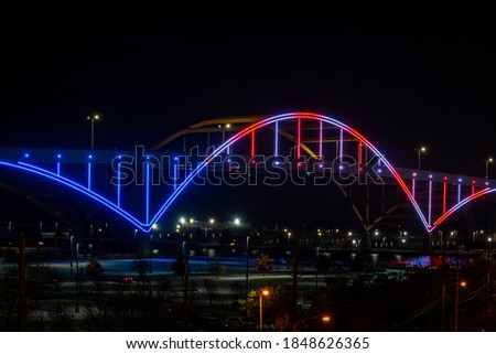 The Hoan Bridge in Milwaukee WI lit up in red, white and blue