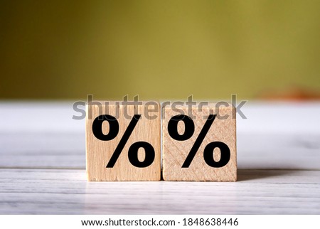 Percent sign on wooden cubes  with copy space. Concept of sale and discount.