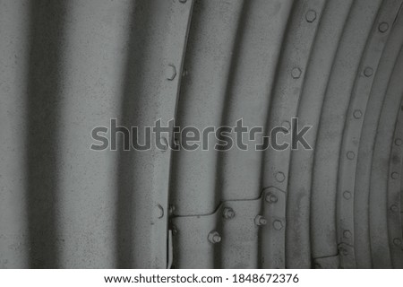 Gray Curved Corrugated Metal Tunnel  