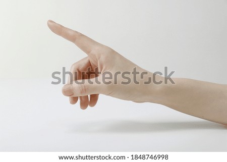 Close-Up Of Cropped Hand Pointing Finger