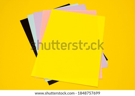 abstract background of colored paper sheets
