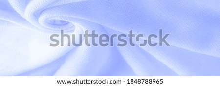 Blue cloth, abstract background of luxury fabric or liquid silk texture of waves or wavy folds. background or elegant wallpaper design. Cotton texture, natural fabric and dye, bright blue color