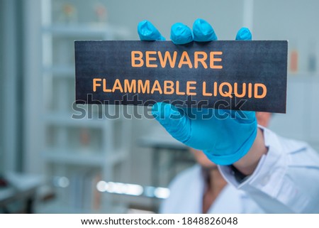 
Scientists hold campaign banners in a laboratory