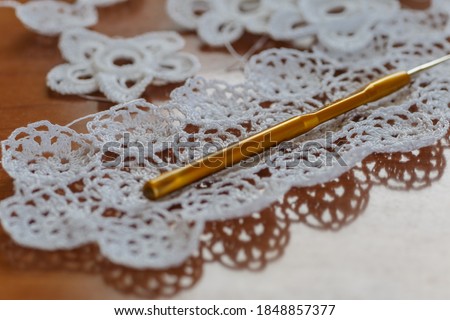 Crochet knitting. Lace of flowers.  Handmade Irish lace as a background