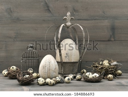 vintage easter decoration with eggs, nest and birdcage. retro style toned picture