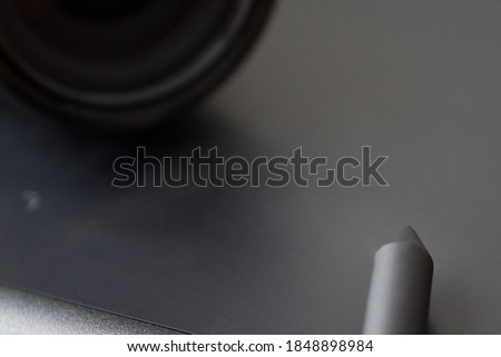 Graphics tablet with stylus and lens for photo post-processing
