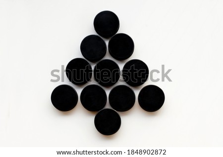 Christmas tree made from hockey puck . Top view. Christmas and New Year Holidays concept. Hockey Christmas tree