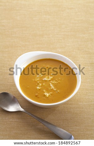 yellow curry and crab in cup and spoon
