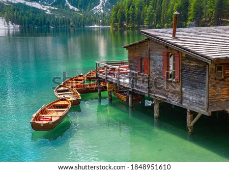 close up of boatshouse in the clear calm water of iconic mountain lake Pragser Wildsee (Lago di Braies) in Dolomites, Unesco World Heritage, South Tyrol, Italy Royalty-Free Stock Photo #1848951610