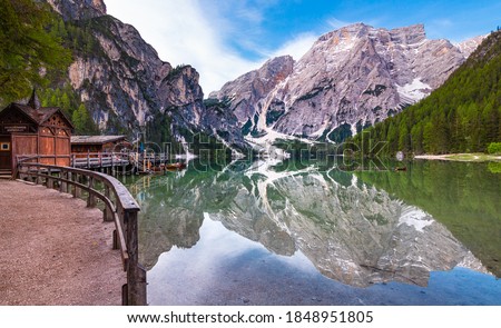 path around iconic mountain lake Pragser Wildsee (Lago di Braies) in Dolomites, Unesco World Heritage, South Tyrol, Italy; Mount Seekofel and boatshouse mirroring in the clam clear water Royalty-Free Stock Photo #1848951805