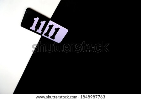 Smartphone with invert black and white 11.11 number and black and white background. Image for 11.11 shopping sales concept.