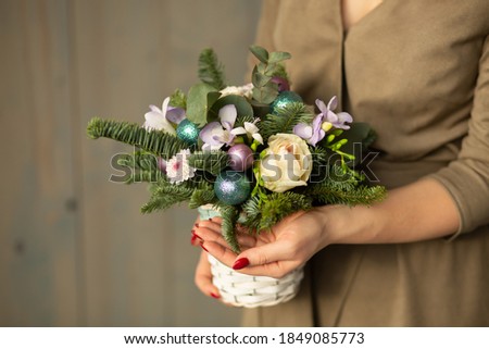 Christmas bouquet of fir and roses for a gift and a holiday

