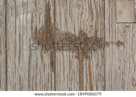 material texture of weathered wood boards with peeling gray pain