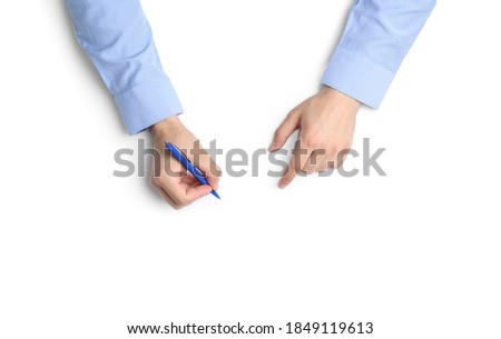 Man with pen on white background, top view. Closeup of hands