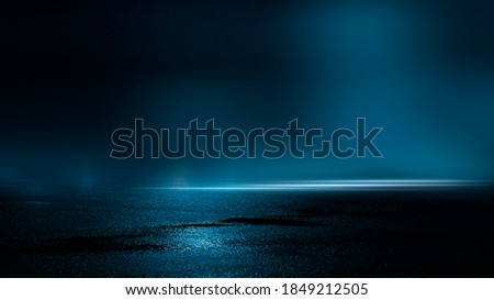 Dark street, wet asphalt, reflections of rays in the water. Abstract dark blue background, smoke, smog. Empty dark scene, neon light, spotlights. Concrete floor Royalty-Free Stock Photo #1849212505