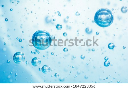 Light blue Air bubbles in alcohol gel. anti virus COVID-19 backdrop. Abstract background about cleanliness, shampoo bubbles, macro bubbles