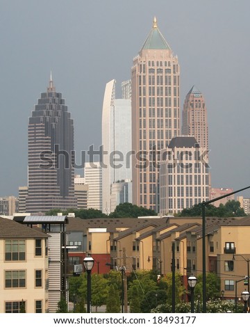 Skyline of Atlanta with rows of townhouses in the foreground