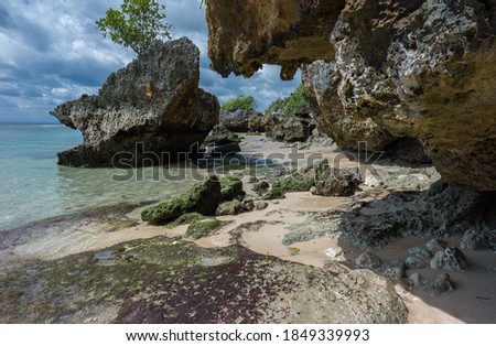 Sea view at rocky Padang-Padang beach at Uluwatu Bali Royalty-Free Stock Photo #1849339993
