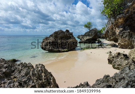 Sea view at rocky Padang-Padang beach at Uluwatu Bali Royalty-Free Stock Photo #1849339996