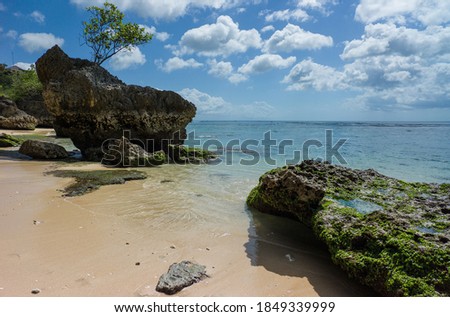 Sea view at rocky Padang-Padang beach at Uluwatu Bali Royalty-Free Stock Photo #1849339999