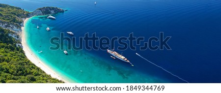 Aerial drone ultra wide panoramic photo of exotic turquoise sandy beach in tropical island blue lagoon
