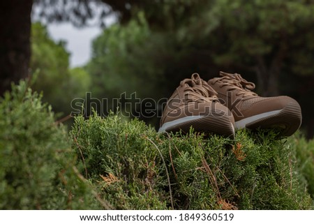 brown sneakers with white sole