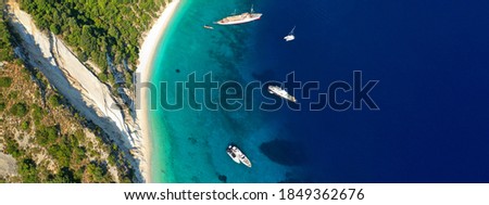 Aerial drone ultra wide panoramic photo of tropical exotic mediterranean bay with luxurious yachts and turquoise sea
