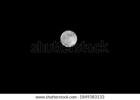 Blue moon on a deep dark sky on October 31, 2020 as seen from San Diego, Ca.