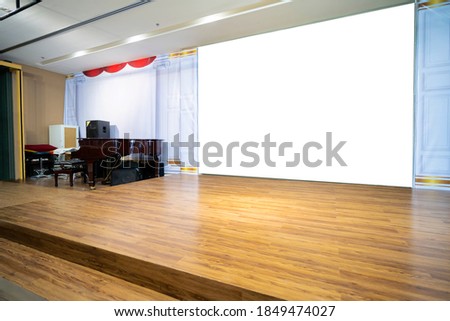 Horizontal blank information banner standing near wooden stage, empty mock-up of poster in urban settings, white clean billboard with copy space for logo, text or other advertising