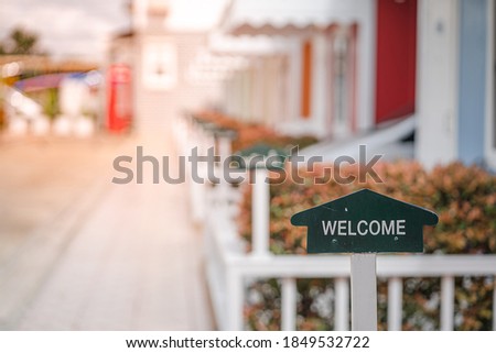Welcome sign in front of motel room for welcoming tourists.