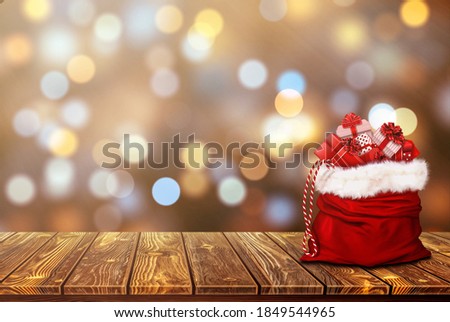 gift bag on the wooden floor Use for background Christmas day