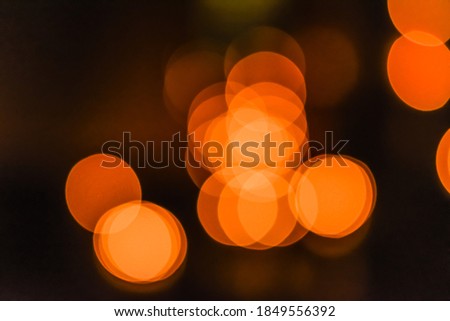 Landscape view of out of focus yellow, orange light bokeh wallpaper or background for texts, images and articles, blank space with blurred background.Large golden bokeh.