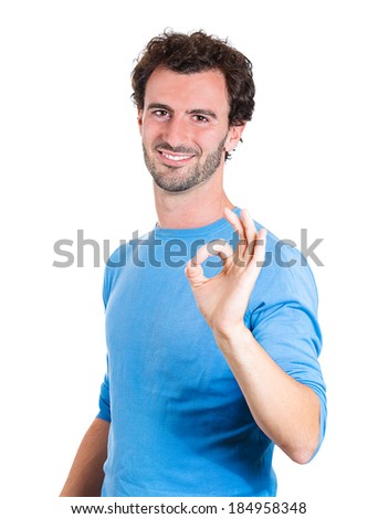 Closeup portrait young handsome happy, smiling excited man, corporate employee, worker giving OK sign with fingers, isolated white background. Positive emotion facial expressions and symbols