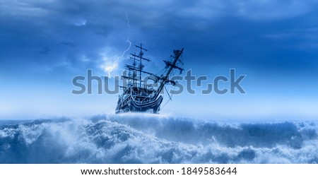Sailing old ship in a storm sea in the background stormy clouds with lightning Royalty-Free Stock Photo #1849583644