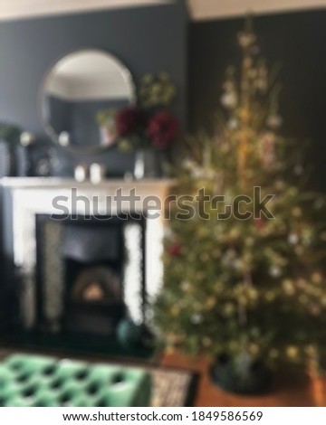 Blurry view of Christmas lights and decoration with presents fit for your Christmas themes and background.