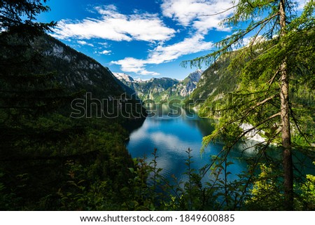 Mountain lake and reflections on a bright sunny day