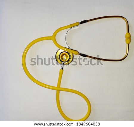 yellow stetoskop isolated on a white background
