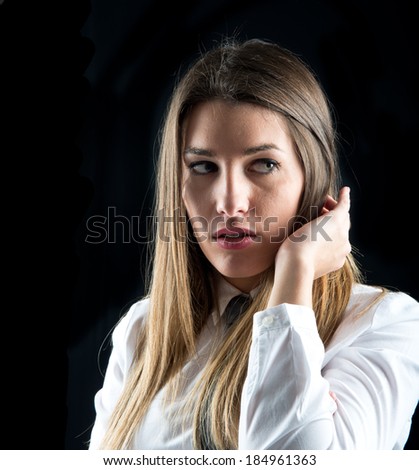 Young businesswoman over isolated black background